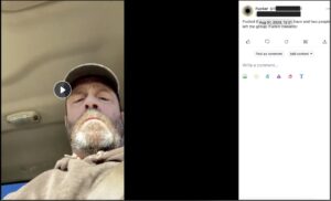 screenshot from gab post dated 8/7/23 shows still from video posted by "Fucker" with userid redactions. A man wearing a tan sweatshirt takes video of himself looking into camera from behind steering wheel of vehicle. The post says "just got done handing out 2000 GDL flyers."