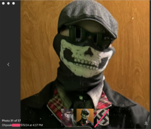 telegram profile pic for ohpeak dated may, 2024. he wears a gray cap,. skull mask, black sunglasses, a black jacket with red plaid lining, a neck gater, and a button-up shirt. previous profile pics are visible at the bottom, including a swastika.